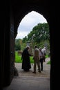 The priest greeting the parishioners at the exit of the mass