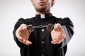 Priest handcuffed Royalty Free Stock Photo