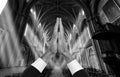 Priest hands inside a church