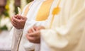 Priest` hands during a wedding ceremony/nuptial mass Royalty Free Stock Photo