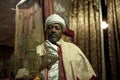 A priest holding a cross, Lalibela