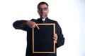 Priest holding empty blackboard copy space Royalty Free Stock Photo