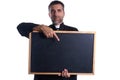 Priest holding empty blackboard copy space Royalty Free Stock Photo