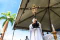 Priest is holding the image of Jesus on the cross on the traditional first Friday of 2023