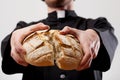 Priest holding loaf of bread