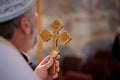 Priest holds a cross Crucifixion of Jesus Christ