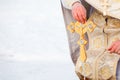 Priest holds golden cross in his hands. Copy space