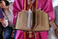 The priest holds the missal, Catholic church in Chunakhali, India