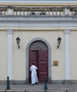 Priest leaving church in Macau China