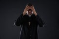 Priest male hands in head worried Royalty Free Stock Photo