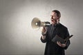 Priest with megaphone Royalty Free Stock Photo