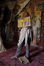 Priest opens an illustrated Bible inside a church in Ethiopia.