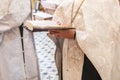 Priest in an Orthodox church reads a prayer from the Bible during a worship service Royalty Free Stock Photo