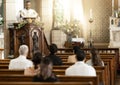 Priest, pastor and spiritual man in church sermon, prayer and speech to catholic people, worship and bible reading