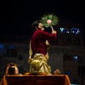 A priest with a peacock feather hand fan, Varanasi, India