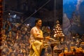Priest performing ganga aarti at dasaswamedh ghat in varanasi