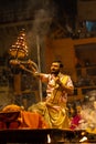 Priest performing ganga aarti at dasaswamedh ghat in varanasi