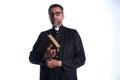 Priest portrait with Holy Bible in hands