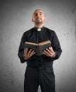 Priest praying Royalty Free Stock Photo