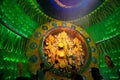 Priest praying to Goddess Durga, Durga Puja festival celebration.