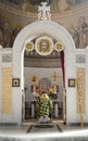 A priest prays for peace in front of the altar in Orthodox church Royalty Free Stock Photo