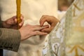 The priest puts a wedding ring on the groom`s finger. Royalty Free Stock Photo