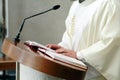 Priest reading open holly bible Royalty Free Stock Photo