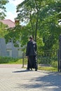 A priest of the Russian Orthodox Church walks through the church. Baltiysk, Kaliningrad region