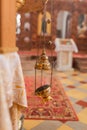 A priest`s censer hanging in the Orthodox Church. Copper incense with burning coal inside Royalty Free Stock Photo