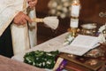 Priest sanctifies wedding rings. Table in the church Royalty Free Stock Photo