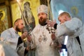 The priest says a prayer to the parishioners of the Christian Orthodox Church. Preacher holds in his hands candlesticks. December Royalty Free Stock Photo