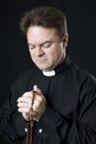 Priest Says the Rosary Royalty Free Stock Photo