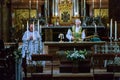 The priest serves Mass and prepares the sacrament in St. Peter`s