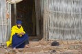 Priest sits at the entrance to the ancient church Ura Kidane Mehret in Bahir Dar, Ethiopia.