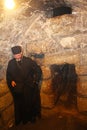 Priest in the St. Lazarus Church, the Tomb of Lazarus, located in the West Bank town of al-Eizariya, Bethany, near Jerusalem