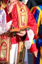 Priest in Vestments Blessing with Swiss Guard at Side