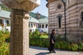 Priest walking inside Cozia monastery