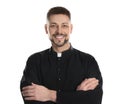 Priest wearing cassock with clerical collar on white background