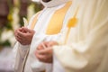 Priest` hands during a wedding ceremony/nuptial mass Royalty Free Stock Photo