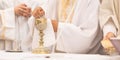 Priest` hands during a wedding ceremony/nuptial mass Royalty Free Stock Photo