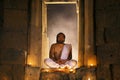 Priest or Yogi are sitting meditating in Ancient ornate huts mad Royalty Free Stock Photo