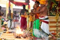 Priests making offering at indian temple ceremony