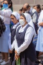 Priests and members of the Catholic church perform a procession Royalty Free Stock Photo