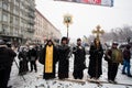 Priests of Ukrainian Orthodox Church stand at front of barricades on the snow winter street during anti-government protest