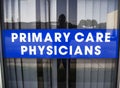 Primary Care Physicians Sign on a the Window of a Commercial Building