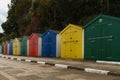 Primary colour beach huts in a row Royalty Free Stock Photo