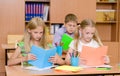 Primary school children in the classroom reading books Royalty Free Stock Photo