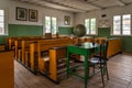 Primary school classroom with antique desks, historic building, Rumsiskes Etnographic museum Lithuania Royalty Free Stock Photo