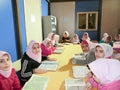 Primary school girls Studying book