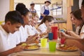 Primary school kids at a table in school cafeteria, close up Royalty Free Stock Photo